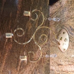 Gold taper candle holder with clear crystals.Apex